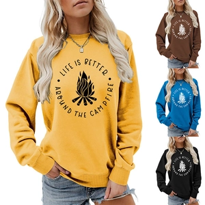 Detail of campfire print on women's sweatshirt with four distinct color options