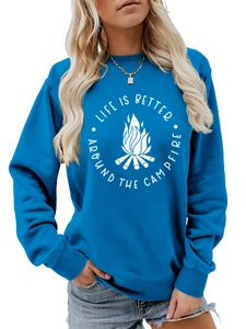 Detail of blue crewneck sweatshirt featuring white campfire print and outdoor slogan