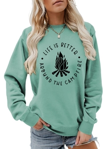 Detail of mint green sweatshirt featuring black campfire graphic and ribbed sleeve cuffs