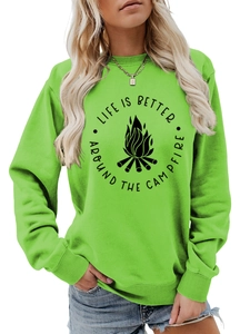 Detail of green crewneck sweatshirt featuring campfire print and Life Is Better text