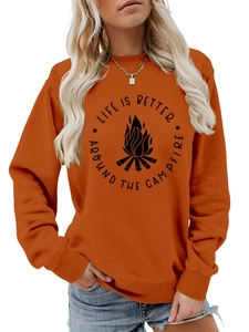 Detail of orange sweatshirt featuring Life is Better Around the Campfire graphic print