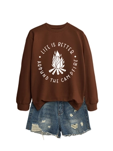 Flat lay of brown campfire sweatshirt and distressed denim shorts set on white background