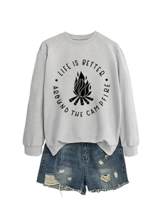 Flat lay of a grey campfire sweatshirt paired with distressed denim shorts