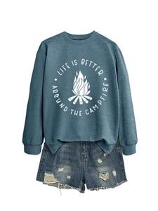 Detail view of crewneck sweatshirt with campfire print and distressed denim shorts set