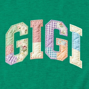 Close-up of GIGI patchwork appliqué with floral patterns on green cotton t-shirt