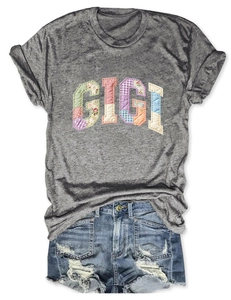 Flat lay of grey GIGI patchwork short sleeve T-shirt with distressed denim shorts