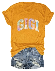 Detail of GIGI floral patch embroidery on yellow crew neck short sleeve cotton T-shirt