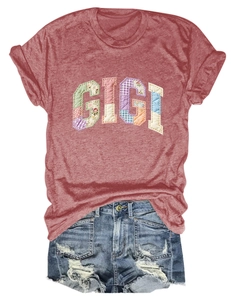 Detail of GIGI floral patchwork on terracotta cotton t-shirt with ripped denim shorts