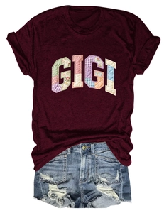 Close-up of wine red t-shirt with GIGI patchwork embroidery and denim shorts set