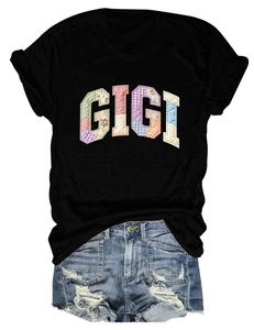 Close-up of GIGI patchwork letters on a black crew neck short sleeve casual t-shirt