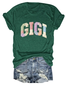 Detail of GIGI patchwork appliqué with floral and plaid fabric on green cotton T-shirt