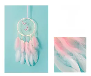 Detail of glowing dream catcher featuring LED lights, pink butterflies and soft feathers