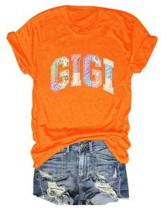 Detail of Gigi floral patchwork applique on bright orange short sleeve cotton t-shirt