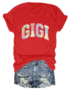 Flat lay of a red GIGI patchwork T-shirt paired with distressed denim shorts
