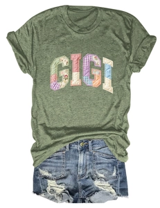 Detail of GIGI colorful patchwork embroidery on a comfortable green short sleeve T-shirt