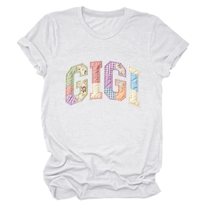 Detailed view of Gigi floral patchwork lettering on a white crew neck short sleeve T-shirt