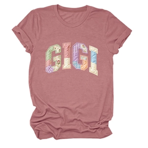 Detail showing GIGI floral patch appliqué on a soft dusty pink cotton women's T-shirt
