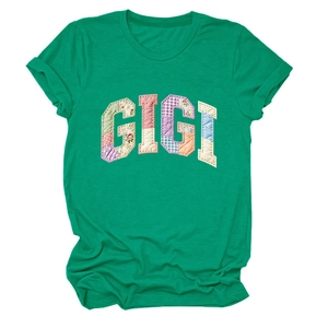 Detail of GIGI floral patchwork embroidery on a green short-sleeved cotton T-shirt