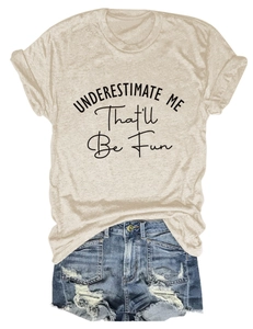 Flat lay of women's round neck T-shirt with 'Underestimate Me' slogan and denim shorts