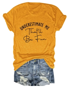 Casual yellow t-shirt with 'UNDERESTIMATE ME' slogan paired with ripped denim shorts