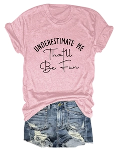 Detail of pink slogan t-shirt with ripped denim shorts showing fabric and print texture