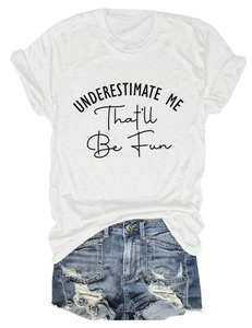 Detail of white cotton T-shirt with black artistic text and ripped blue denim shorts