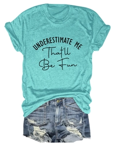 Flat lay of teal slogan T-shirt with denim shorts on white background