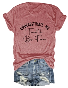 Flat lay of a red heathered t-shirt with slogan and ripped denim shorts for summer