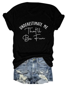 Detail of women's black crewneck tee with slogan print and distressed denim shorts