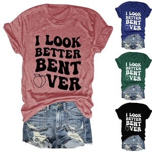 Detailed view of women's crew neck T-shirt with bold slogan and peach graphic in multiple colors