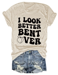 Detail of apricot T-shirt with vintage bold text and peach print on white background