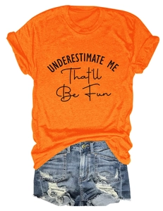 Flat lay of an orange crewneck t-shirt and distressed blue denim shorts with fringe