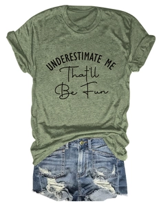 Flat lay of a grass green crew neck T-shirt with black slogan print and denim shorts