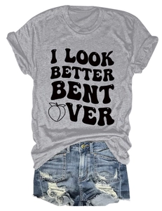 Flat lay of gray crew neck t-shirt with slogan print and distressed denim shorts
