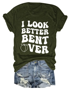 Flat lay of olive green cotton t-shirt with peach slogan and ripped denim shorts set