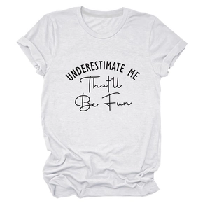 Detail view of cotton t-shirt with Underestimate Me slogan print on white fabric