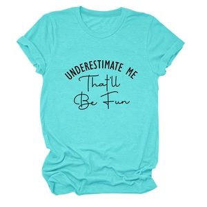 Flat lay of an aqua crew neck t-shirt featuring the slogan UNDERESTIMATE ME That'll Be Fun