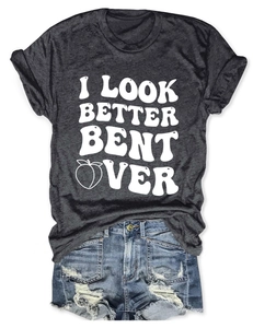 Detail of grey crewneck t-shirt with peach graphic and distressed blue denim shorts