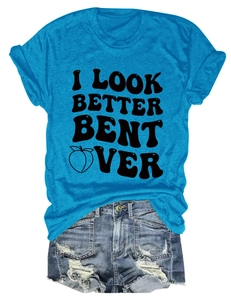 Flat lay of bright blue crew neck t-shirt with black graphic text and denim shorts