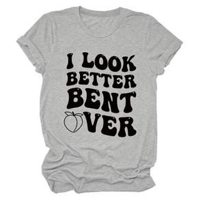 Detail of grey crewneck T-shirt featuring bold black text slogan and peach graphic print