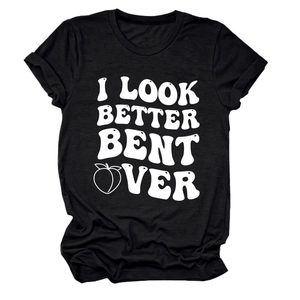 Detailed flat lay of black cotton t-shirt featuring bold white text and peach graphic