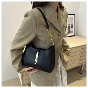 Fashionable black leather Hobo shoulder bag with gold vertical metal lock and chain strap