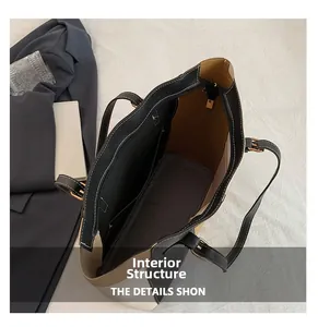 Macro view of the spacious inner compartment with zipper pocket of this leather tote bag