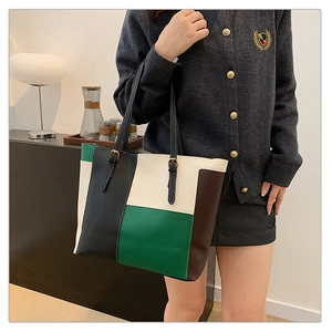 Chic color-block PU leather tote bag for women with contrast stitching and adjustable strap