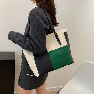 Modern color-block faux leather tote bag with adjustable straps for women's daily commute