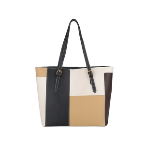 Minimalist multi-color patchwork leather tote bag with black shoulder straps on white background