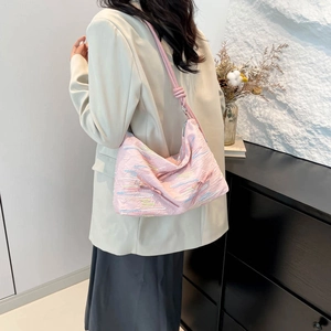 Pink pleated fabric shoulder bag with floral embroidery and knot strap detail