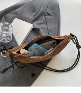 Interior view of leopard print crossbody bag showing spacious capacity for phone and makeup