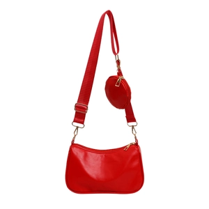 Red 2-piece faux leather baguette shoulder bag with adjustable strap and small round pouch