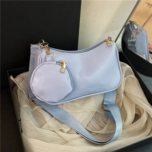 Light blue faux leather shoulder bag with matching coin pouch and gold hardware